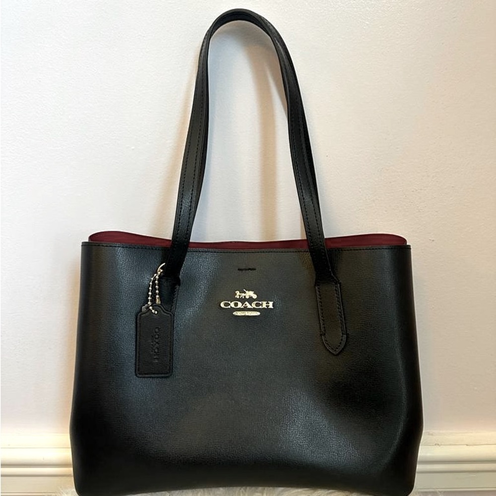 Coach  large Avenue Carry all in black with red interior.